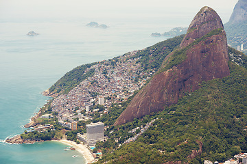 Image showing Coastline, mountains or drone with city, seaside or environment with holiday or getaway trip. Brazil, earth or clouds with water or waves with vacation or buildings with beach, aerial view or nature