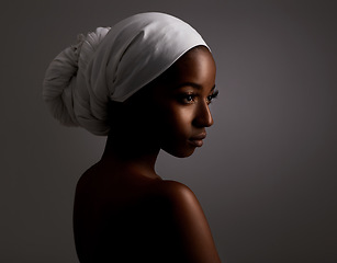 Image showing Beauty, thinking and black woman in dark studio with head scarf, skincare and pride in culture. Cosmetics, skin glow and face of African model for dermatology, spa and girl on grey background