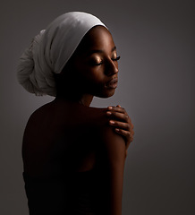 Image showing Beauty, relax and black woman in dark studio with head scarf, skincare and pride in culture. Cosmetics, skin glow and face of African model with dermatology, makeup and girl on grey background