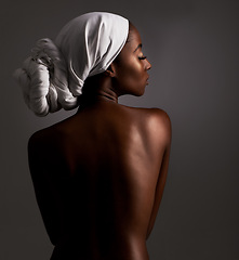 Image showing Beauty, body and heritage with natural black woman in studio on gray background for wellness. Skincare, culture or tradition and aesthetic young model in Africa for cosmetics or dermatology from back