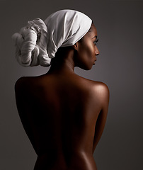 Image showing Beauty, body and culture with natural black woman in studio on gray background for wellness. Skincare, heritage or tradition and aesthetic young model in Africa for cosmetics or dermatology from back