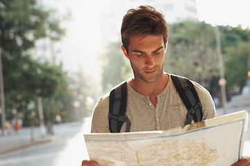 Image showing Man, city and tourist with map for destination, location or tour guide in street or road. Male person or traveler looking at geographic paper on adventure route, journey trail or outdoor path in town