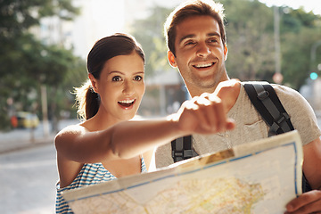 Image showing Couple, pointing or map for tourist destination with direction, tour route and excited on holiday and vacation in Brazil. Face, man and woman with smile in city street for explore, tourism and travel