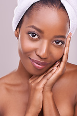 Image showing Woman, face and towel for skincare in studio with beauty, dermatology and facial glow on a white background. Portrait of young model or African person smile for hygiene, cosmetics or natural makeup