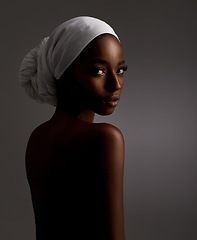 Image showing Portrait, beauty and culture with natural black woman in studio on gray background for wellness. Skincare, heritage and tradition with back of young person in headwear for cosmetics or dermatology