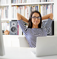 Image showing Woman, laptop and desk for remote work, thinking and relax technology for web development. Communication and done networking for social media, internet connection for finish and computer designer