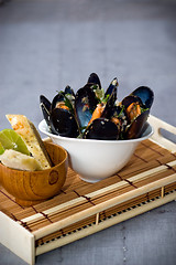 Image showing Fresh Mussels in a simple white bowl 