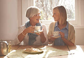 Image showing House, senior and daughter together with tea for breakfast with biscuits, health and snacks with woman. Female person, smile and happiness with mother in family home, elderly and girl with coffee