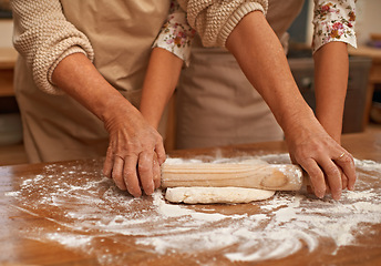 Image showing Hands, help and flour for kneading dough made with love for baking, homemade pie and bonding while learning. Teaching, skills and support for rolling pastry for tart or dessert and handmade closeup.