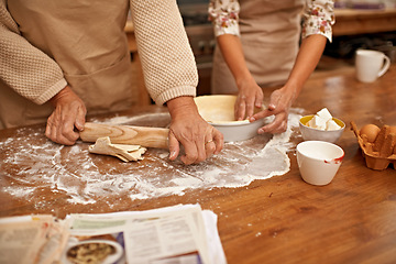 Image showing Hands, dough and people baking in kitchen of home together closeup with ingredients for recipe. Cooking, food or flour with baker and chef in apartment for fresh pastry preparation from above