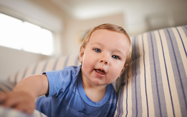 Image showing Portrait, baby boy and smile in sofa relaxing, resting and playing in living room. Newborn, growth and development at home child or infant, happiness and casual or clothes in house or indoor