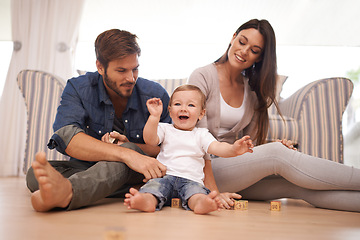 Image showing Parents, baby or building blocks on floor, love or growth or development toys for sensory play in living room. Happy family, kid or interactive game for child or bonding together with care in home