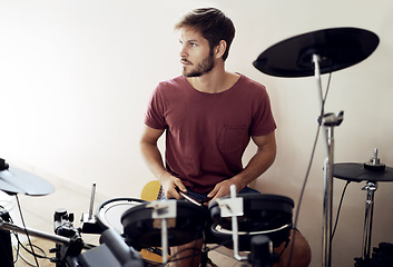 Image showing Drummer, man and music with percussion drums on stage, rhythm and talent with band. Creative person, practice and performing as artist or professional musician and audio entertainment on instrument