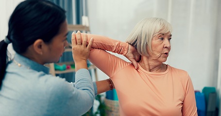 Image showing Physiotherapy, stretching and senior woman in consultation for support, exam and helping with shoulder or muscle. Doctor, physiotherapist or nurse and elderly patient arm or elbow, check and service