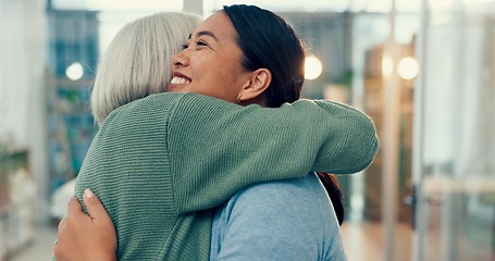 Image showing Senior woman, hug and old friend at a business office with a smile, support and excited. Elderly person, love and happy women together at a workplace with care from staff at physiotherapy with health