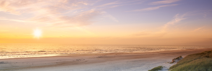 Image showing Beach, sunset and sunshine with clouds, Bali and drone for aesthetic and travel environment and sea. Beautiful sky, ocean and landscape in view, trip and vacation for nature and sunlight tranquility