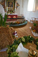 Image showing Christian, shrine or altar in church for religion, worship and spiritual festival or ceremony in Danish culture. Praise, god and painting of Jesus in chapel interior with flowers and holy decoration