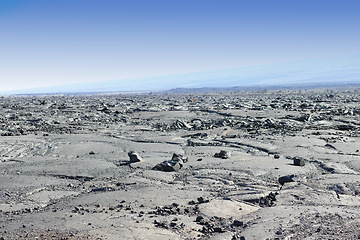 Image showing Terrain, mountain and natural landscape with blue sky for rocks, summit and travel destination. Nature, volcano and environment for hiking trail, rough surface and outdoor adventure in Indonesia.