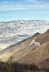 Image showing Mountain, summit and natural landscape with blue sky, terrain and desert scenery for travel destination. Earth, nature and environment for countryside, outdoor adventure or explore in California.