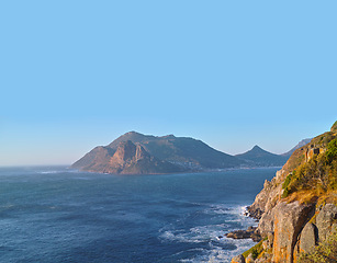 Image showing Beach, drone and mountain in island, paradise and tourist destination for summer vacation in nature. Aerial, ocean and blue in sky in cape town, peace and outdoor travel of sustainable environment