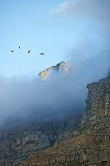 Image showing Mountain, clouds and natural landscape with blue sky, scenery and peace for travel destination. Earth, nature and environment for outdoor adventure, explore and holiday location in Cape Town.