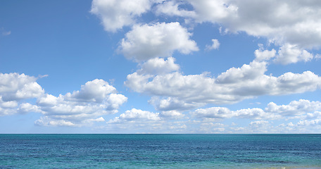 Image showing Blue sky, ocean and clouds with horizon background for peace, nature and environment with skyline seascape of tropical beach. Calm water, sea and earth with location for break or vacation with view