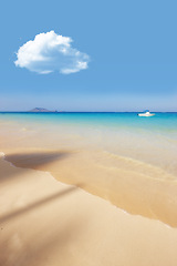 Image showing Sea, boat and blue sky for holiday, sand and rocks in Hawaii for peace and tranquility. Seaside, waves and summer for vacation, location and beach for clear water on travel and tropical trip by ocean