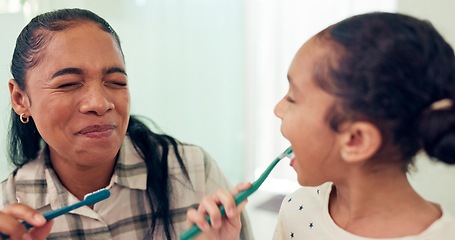 Image showing Smile, brushing teeth and mother with daughter, morning routine and child development in bathroom. Happy family or mama with kid and dental with wellness or toothbrush with fresh breath and funny