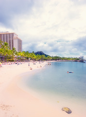 Image showing Sand, ocean and beach in Hawaii city for tropical holiday, vacation and travel destination. Nature, island and seashore, waves and water in summer weekend for location, natural background and horizon