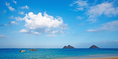 Image showing Boat, ocean and landscape of beach in Hawaii for tropical holiday, vacation and travel destination. Nature, island and seashore, waves and water in summer weekend for location, background and horizon