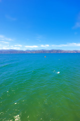 Image showing Blue sky, nature and drone of ocean on island for travel, vacation or holiday with skyline and seascape. Outdoor, water and aerial view of sea by tropical beach for scenic summer weekend trip.