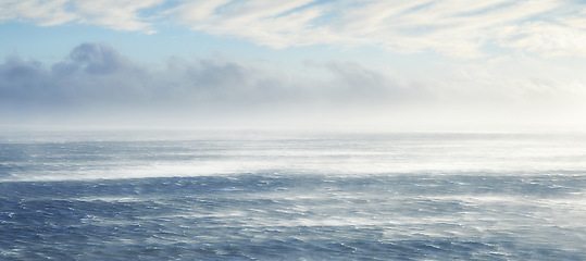 Image showing Clouds, sky and sea with rocks in nature for vacation, holiday or weekend trip in summer. Stones, banner and ocean waves by tropical island for travel in Cape town for outdoor paradise scenery.