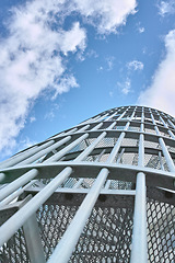 Image showing Staircase, sky and clouds for building outdoor in summer for modern design and art for architecture. Spiral, tall and metal for urban and editorial for pattern on dome, landmark and feature in city