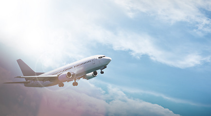 Image showing Airplane, transportation and flight with sky for travel with journey, lens flare and flying in air for tourism. Drone view, commercial aircraft and aeroplane with departure, arrival and destination