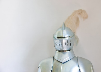 Image showing Knight, medieval suit and armor with mockup space of soldier, statue or honor on a gray studio background. Helmet, gear or equipment for battle, war or security in justice, shining silver or visor