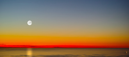 Image showing Ocean, moon and sky with sunset background for environment, summer and holiday on a banner mockup. View of landscape with horizon, skyline and evening for peace, zen and travel or vacation with space