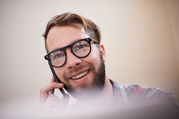 Image showing Happy man, face and phone call with glasses for conversation, communication or networking at home. Young male person or freelancer with smile on mobile smartphone for friendly discussion at the house