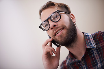 Image showing Young man, face and phone call with glasses for conversation, communication or networking at home. Happy male person or freelancer with smile and mobile smartphone for friendly discussion on mockup