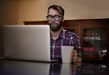 Image showing Creative man, laptop and glasses with coffee for remote work, communication or networking at home. Male person or freelancer working on computer with mug or cup of tea for online research at house