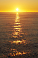 Image showing Ocean, sunset and landscape of water scenic view, environment and waves in sea. Tropical island, clouds and golden sky on beach sunshine, summer or evening and peaceful for travel or holiday