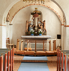Image showing Christian, shrine and sculpture in church for religion, worship and spiritual space for Catholic ceremony or culture. Praise, god and art of Jesus in cathedral chapel with kneelers in aisle to pray