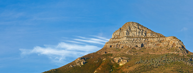 Image showing Mountain, blue sky and peak with natural landscape for travel location, outdoor adventure and environment. Banner, nature and landmark for peace, explore and holiday destination in Cape Town.