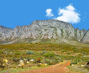 Image showing Mountain, blue sky and hiking with travel location, journey and terrain in natural landscape. Nature, landmark and environment for outdoor adventure, explore and holiday destination in South Africa.