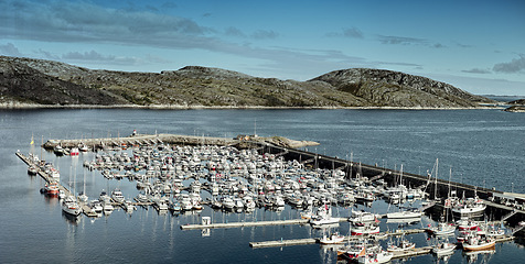 Image showing Harbor, ship and port in outdoors, travel and yacht on holiday or vacation or location. Marina, seaside and boat on water for peace or calm at dockyard, cruise transport and ocean or sea on island