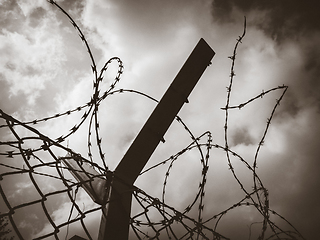 Image showing Barbed wire fence black and white picture