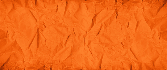 Image showing Orange crumpled paper texture. Banner background