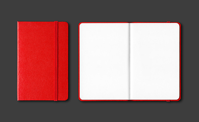 Image showing Red closed and open notebooks isolated on black