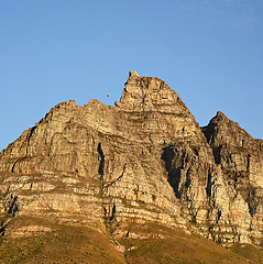 Image showing Mountain, blue sky and scenery with natural landscape for travel location, outdoor adventure and environment. Nature, landmark and peace for explore, journey and holiday destination in Cape Town.
