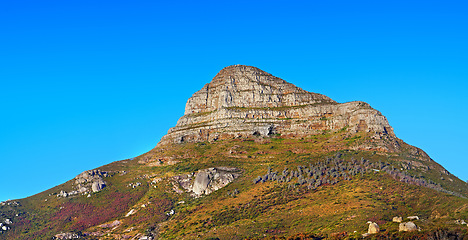 Image showing Low angle, mountain and blue sky with natural landscape for travel location, outdoor adventure and environment. Banner, nature and landmark for peace, scenery and holiday destination in Cape Town.