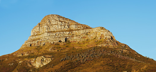 Image showing Mountain, blue sky and summit with natural landscape for travel location, outdoor adventure and environment. Banner, nature and landmark for peace, explore and holiday destination in Cape Town.